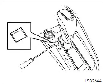 Accessing the mechanical shift lock release mechanism inside a Nissan Versa center console