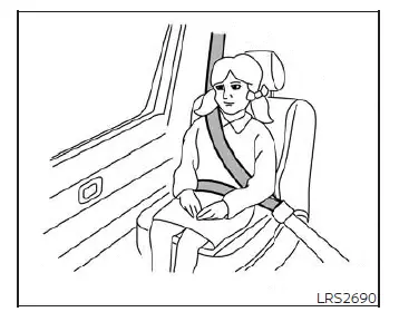 A child passing the safety fit test in the rear seat of a Nissan Versa, showing their back flat against the seatback, knees bent over the cushion edge, and the seat belt correctly aligned over the shoulder and hips
