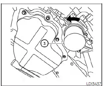 Locating the engine oil filter underneath the engine of a Nissan Versa