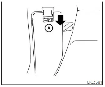 Driver side fuse panel location under the dashboard of the Nissan Versa showing the location of the extended storage switch