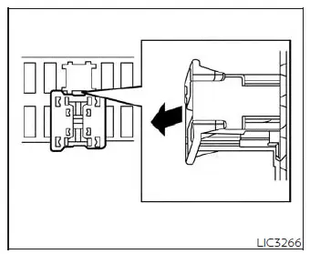 Close-up view of the Nissan Versa extended storage switch in the pulled out position to save battery power during transit
