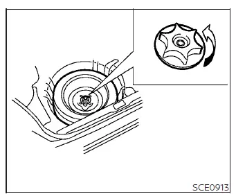 Spare tire fastening bolt and securing mechanism in the trunk of a Nissan Versa