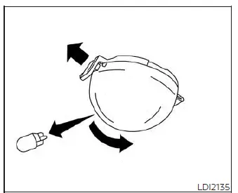 Accessing and replacing the trunk light bulb inside the luggage compartment of a Nissan Versa