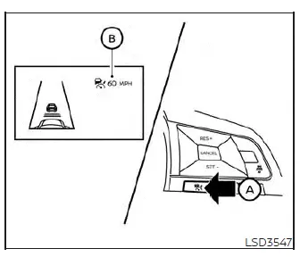 Driver initiating the Intelligent Cruise Control mode via steering wheel controls in a Nissan Versa