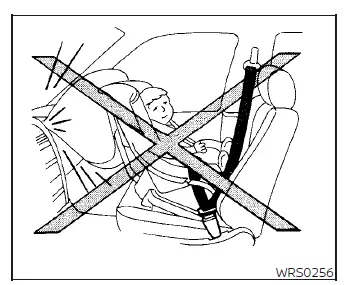 Warning illustration demonstrating that a rear-facing child safety seat must never be installed on the front seat of a Nissan Versa due to active passenger airbag risks