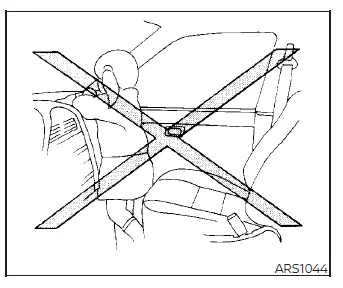 Warning diagram showing the extreme danger of holding a baby in your arms while riding in the front passenger seat of a Nissan Versa