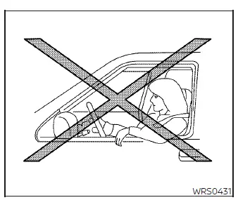 Warning diagram showing a rear-facing infant seat installed in the front passenger seat of a Nissan Versa, demonstrating how a deploying airbag strikes the child seat