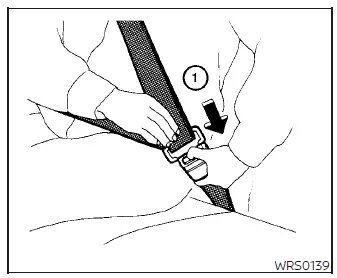 Instructional diagram showing how to unfasten the three-point seat belt in a Nissan Versa by pushing the red release button on the buckle
