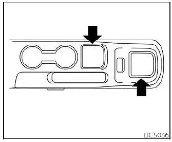 Open storage tray located on the lower center console ahead of the shifter in the Nissan Versa