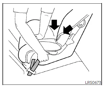 Compressing the child restraint cushion downward and rearward while pulling the LATCH webbing to remove slack in a Nissan Versa